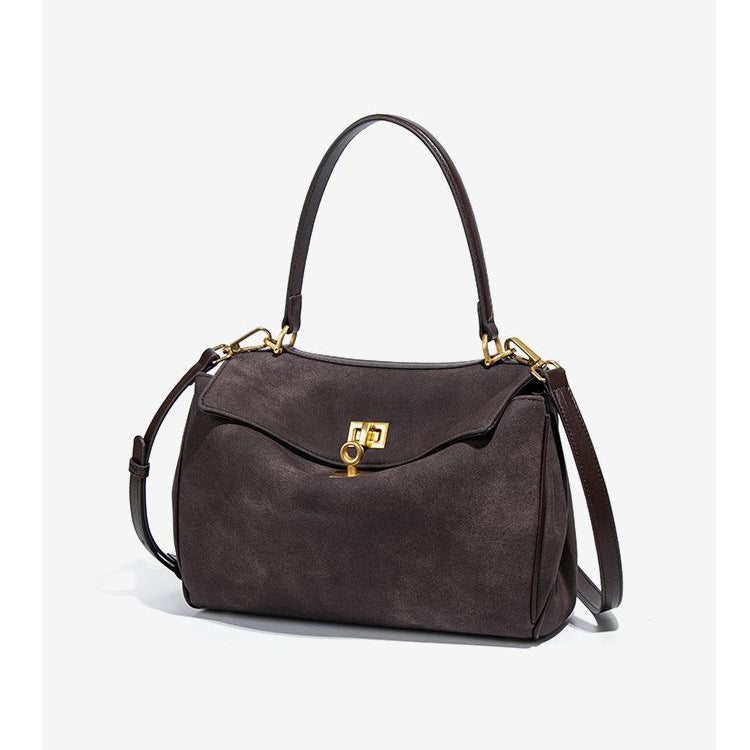 Brown leather handbag with gold hardware, perfect for fashion enthusiasts and ملابس lovers