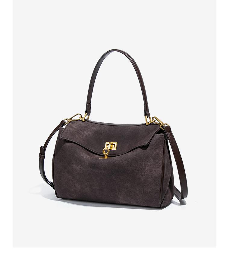Brown leather handbag with gold hardware, perfect for fashion enthusiasts and ملابس lovers