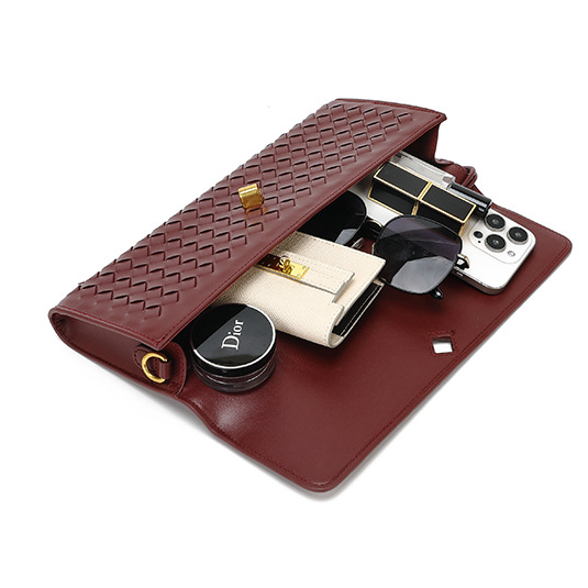 Burgundy woven leather clutch with contents from the Soft Leather Mid Ancient Baguette Bag, fashion ملابس