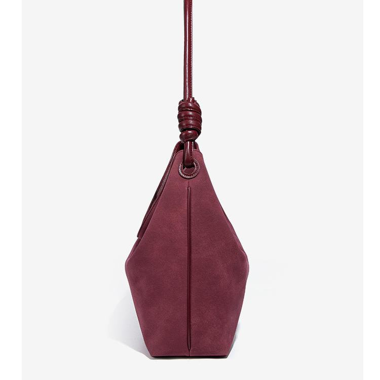 Luxury Frosted Office Bucket Bag showcases a maroon leather handbag with knotted handle for sophisticated fashion style