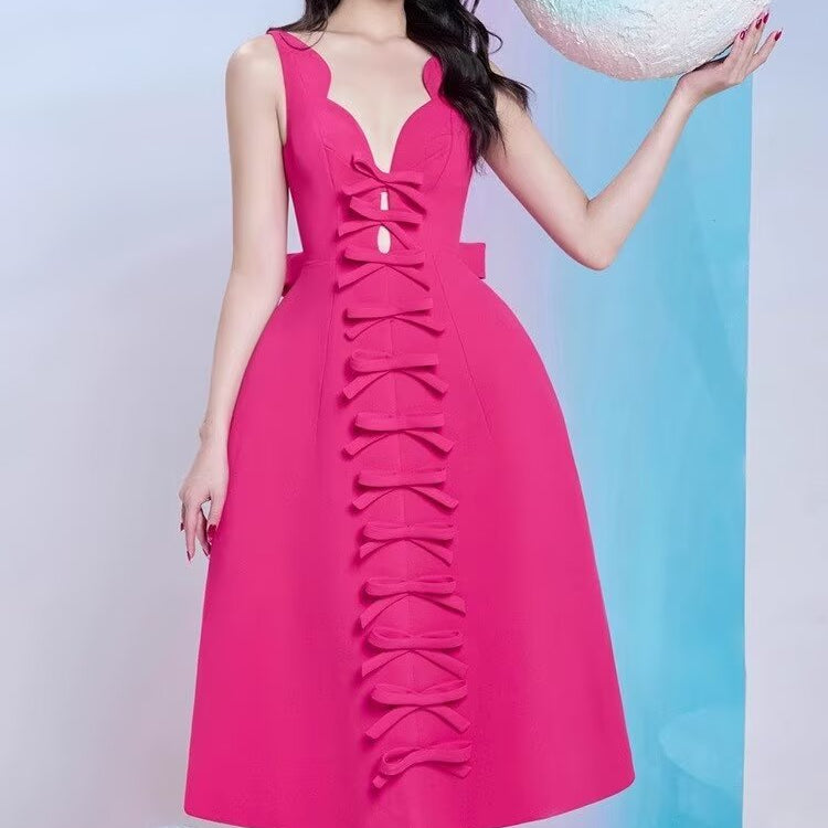 Fuchsia sleeveless fashion dress with bow accents, stylish ملابس for special occasions