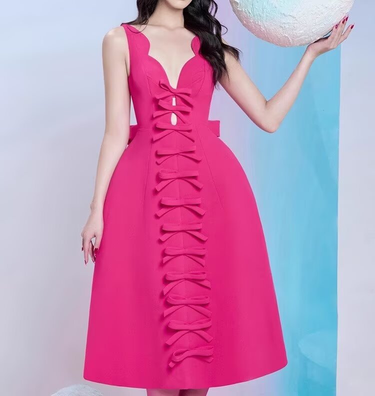 Fuchsia sleeveless fashion dress with bow accents, stylish ملابس for special occasions