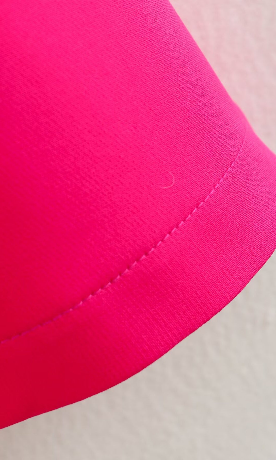 Bright pink fabric with stitched hem on the Stereo Bowknot Decoration Dress for stylish ملابس