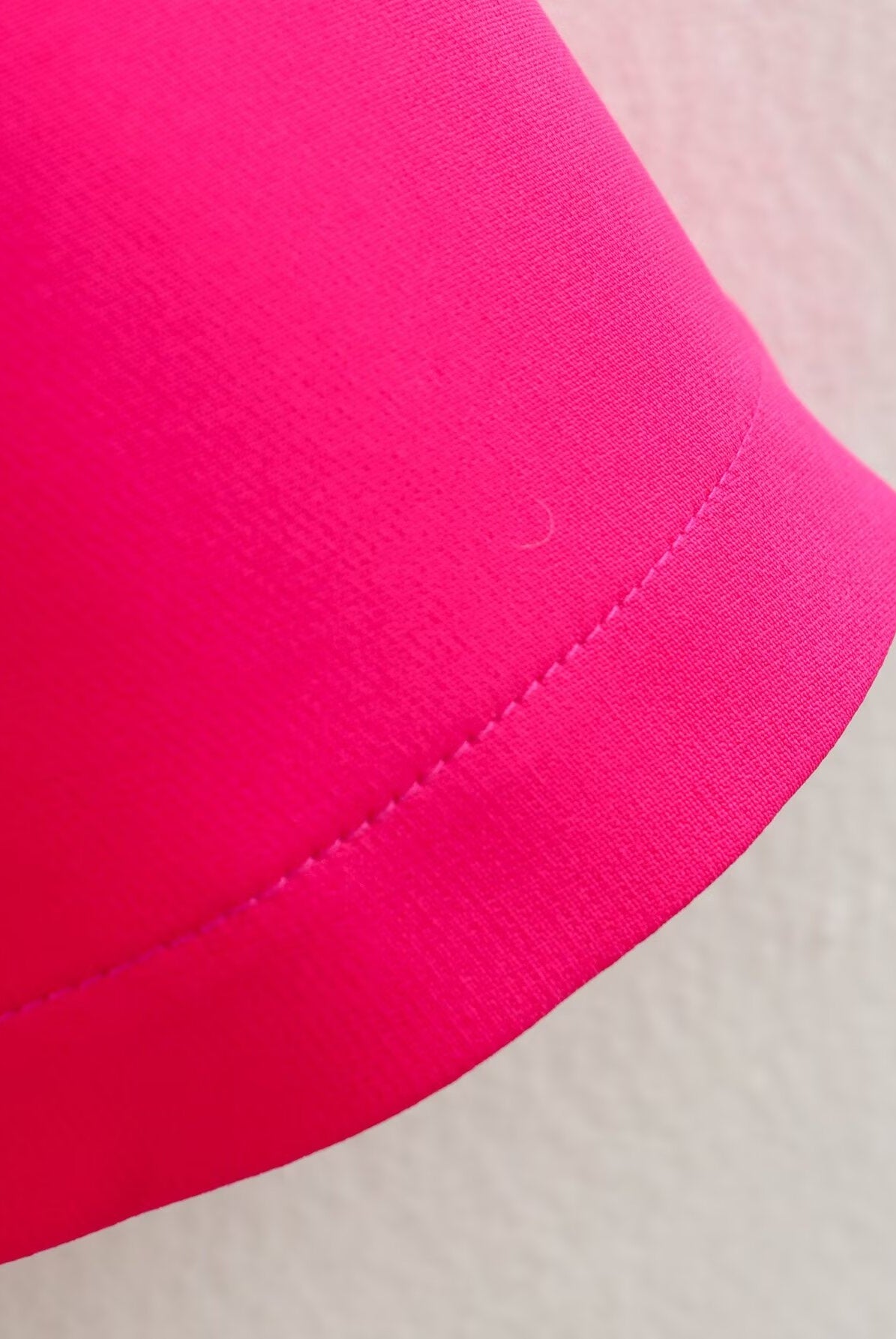 Bright pink fabric with stitched hem on the Stereo Bowknot Decoration Dress for stylish ملابس