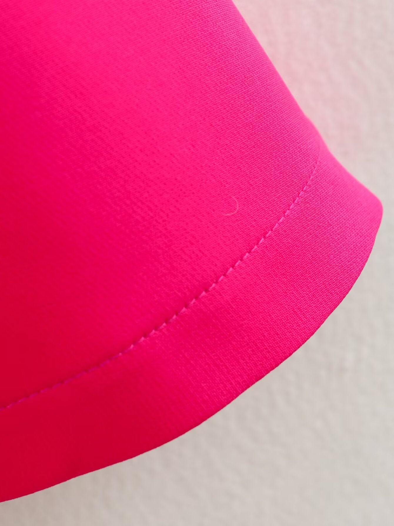 Bright pink fabric with stitched hem on the Stereo Bowknot Decoration Dress for stylish ملابس