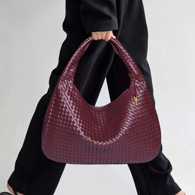 Burgundy woven leather hobo bag, a stylish accessory for fashion enthusiasts
