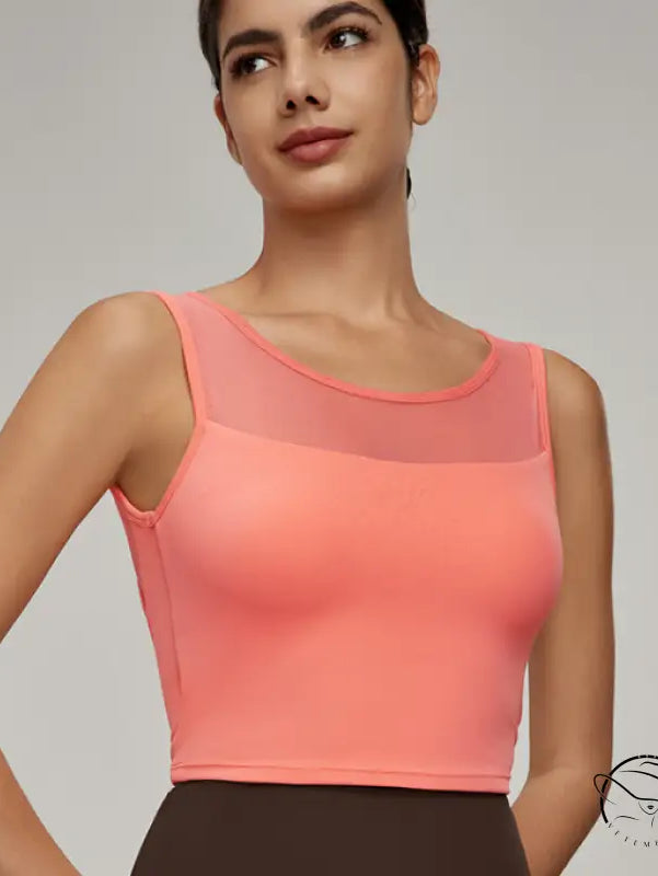 Beauty Back Mesh Workout Top: coral sleeveless crop with sheer chest panel