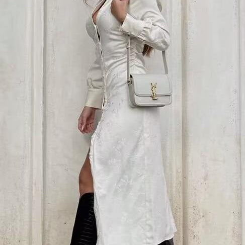 White langry fashion dress with ruched V-neck bodice and boots