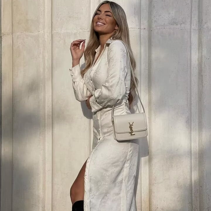 Elegant white Langry V-neck jacquard drawstring dress with high slit and YSL crossbody bag