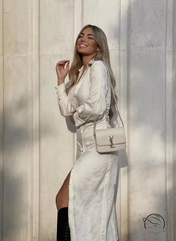 White langry V-neck jacquard drawstring dress with high slit and YSL bag