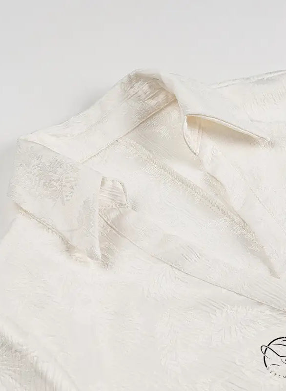 White silk langry blouse with floral embroidery and V-neck buttons