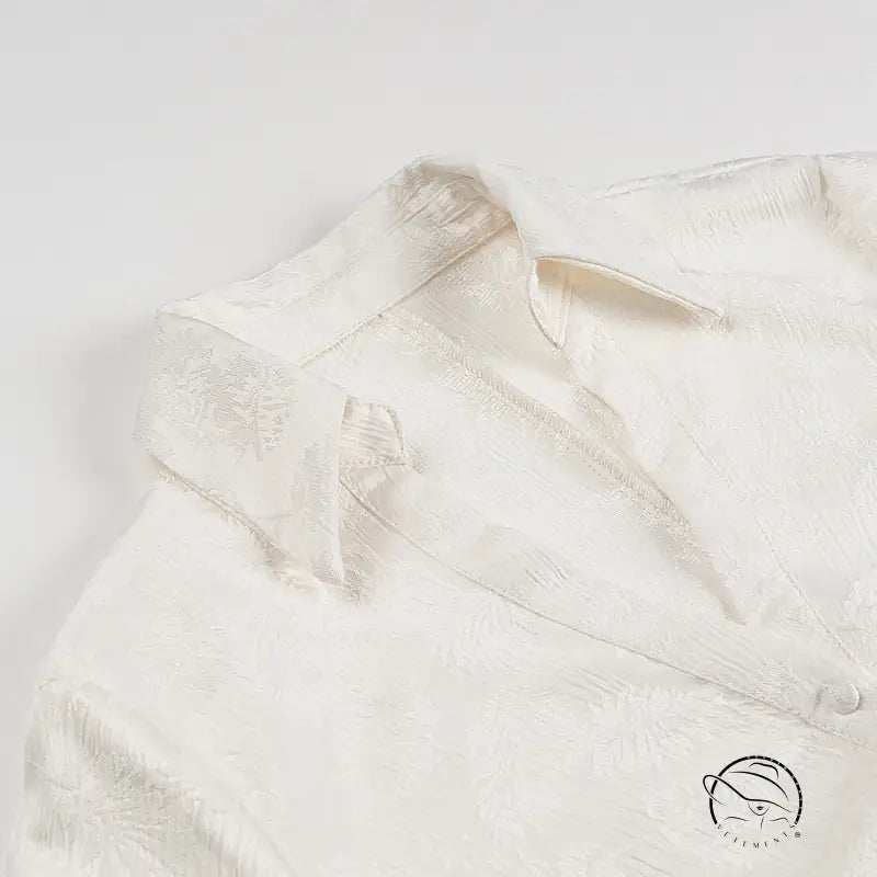 White silk langry blouse with floral embroidery and V-neck buttons