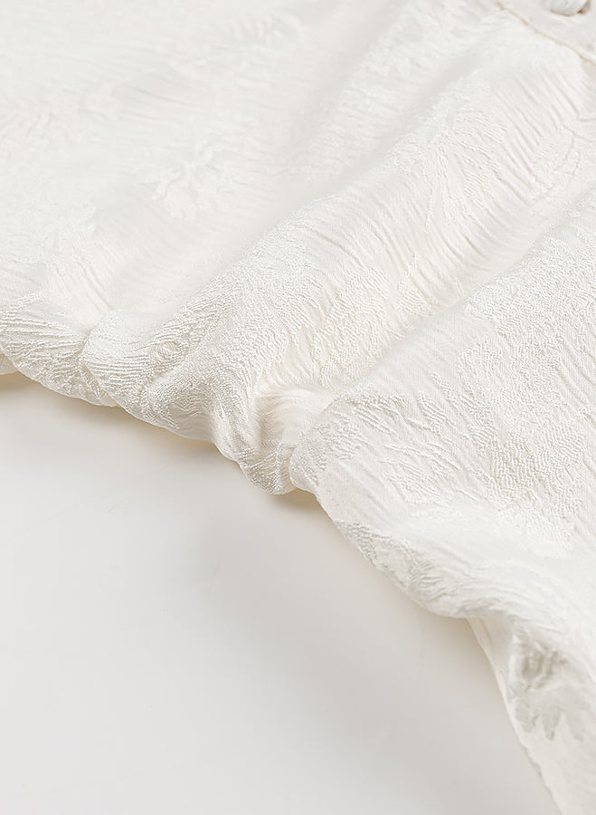 White lace floral fabric with frayed edges in Langry fashion dress