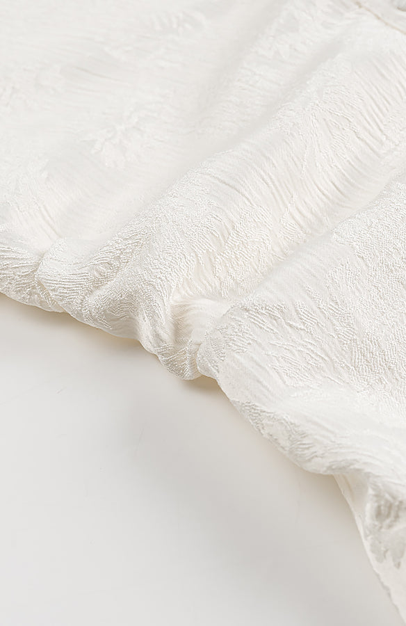 White lace floral fabric with frayed edges in Langry fashion dress