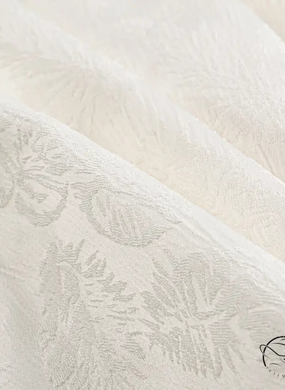 Cream-colored floral brocade Langry fashion dress fabric with leaf patterns