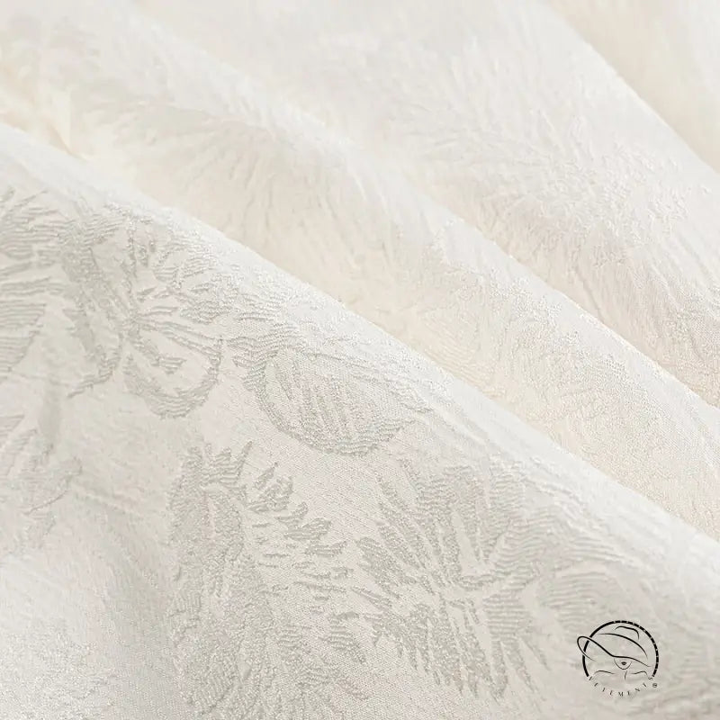 Cream-colored floral brocade Langry fashion dress fabric with leaf patterns