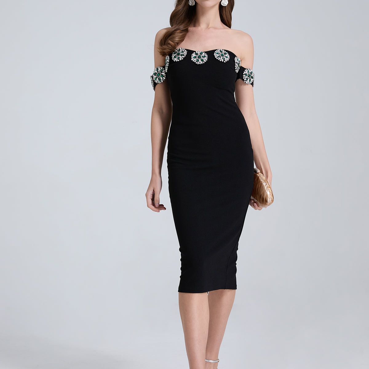 Elegant black off-shoulder cocktail dress with floral trim for fashionable occasions