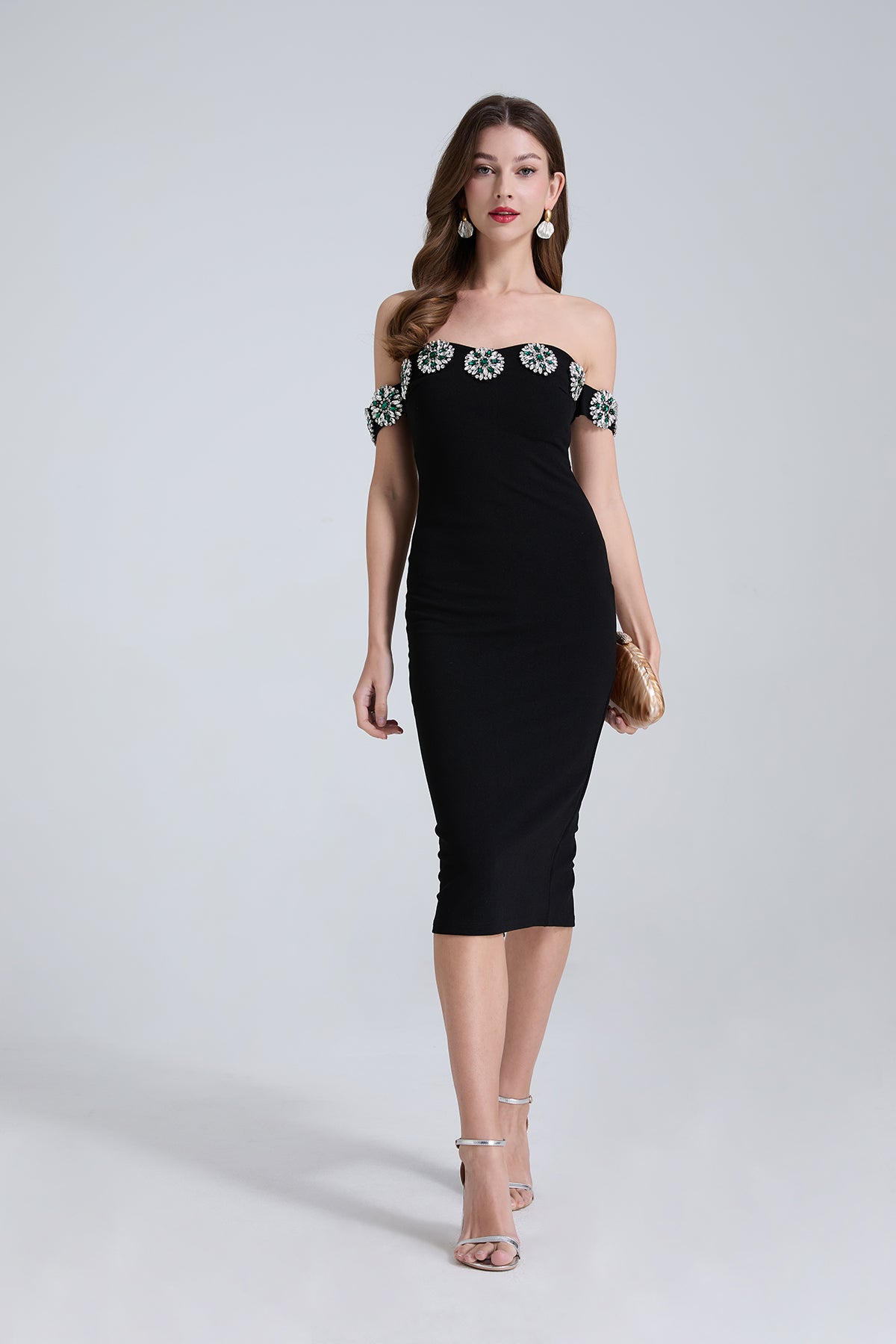 Elegant black off-shoulder cocktail dress with floral trim for fashionable occasions