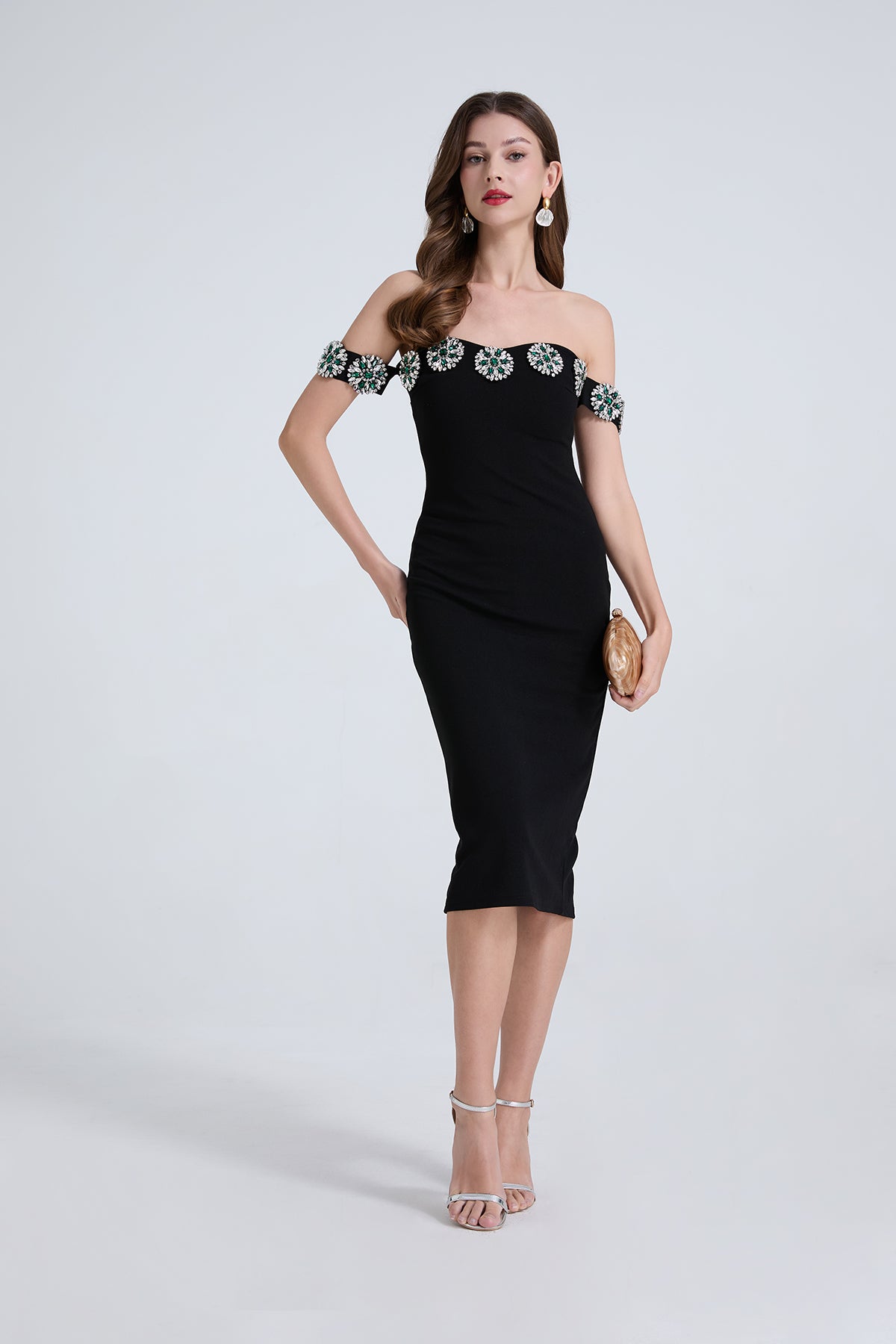 Elegant black off-shoulder cocktail dress with silver floral embellishments in fashion ملابس