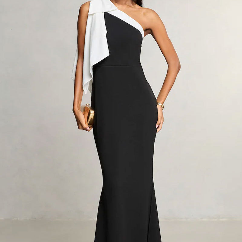 Elegant black and white evening gown showcasing stunning fashion in ملابس design