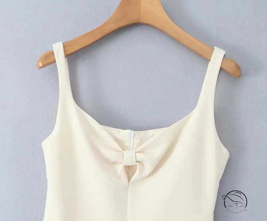 Stunning retro backless dress in white langry fashion with bow neckline on hanger