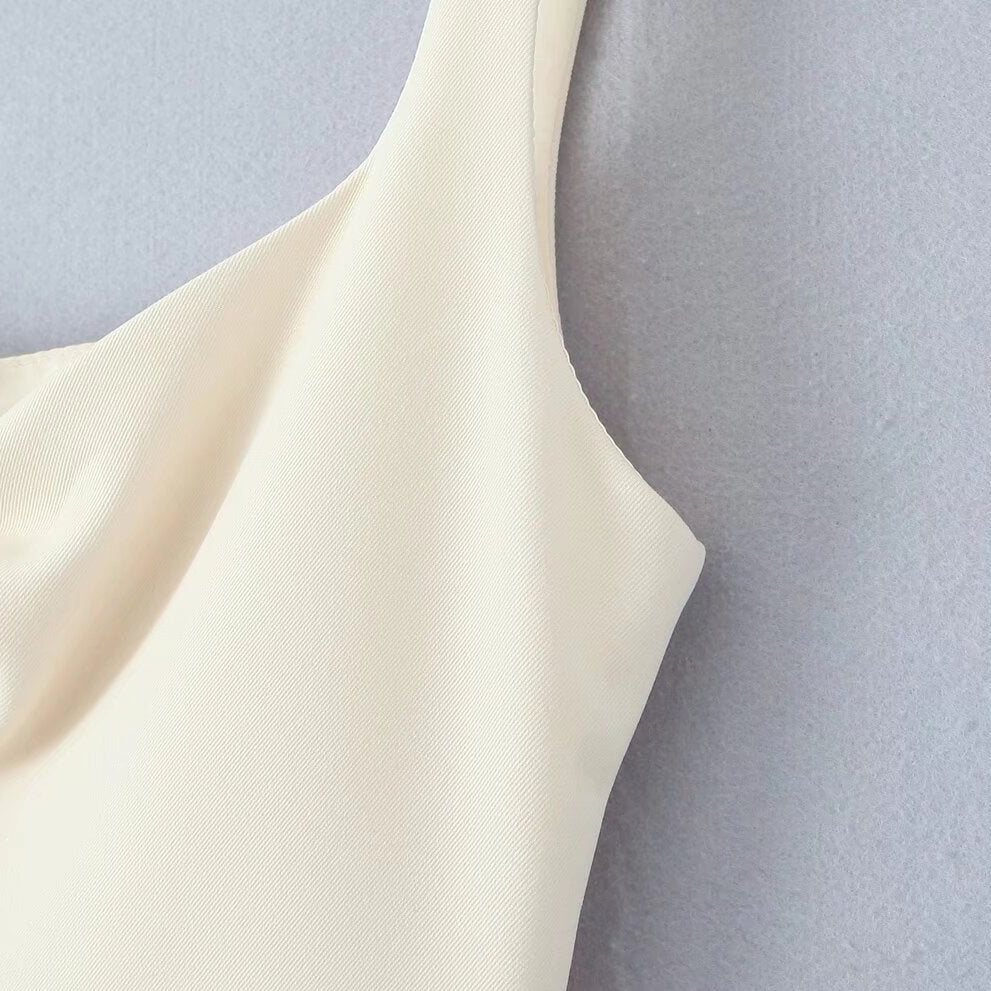 Cream-colored sleeveless garment with curved neckline from the Stunning Retro Backless Dress