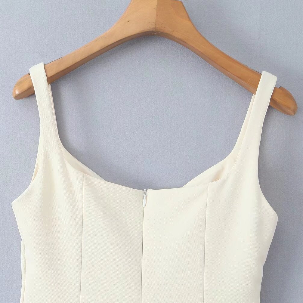 White sleeveless top on a wooden hanger, part of Stunning Retro Backless Dress fashion