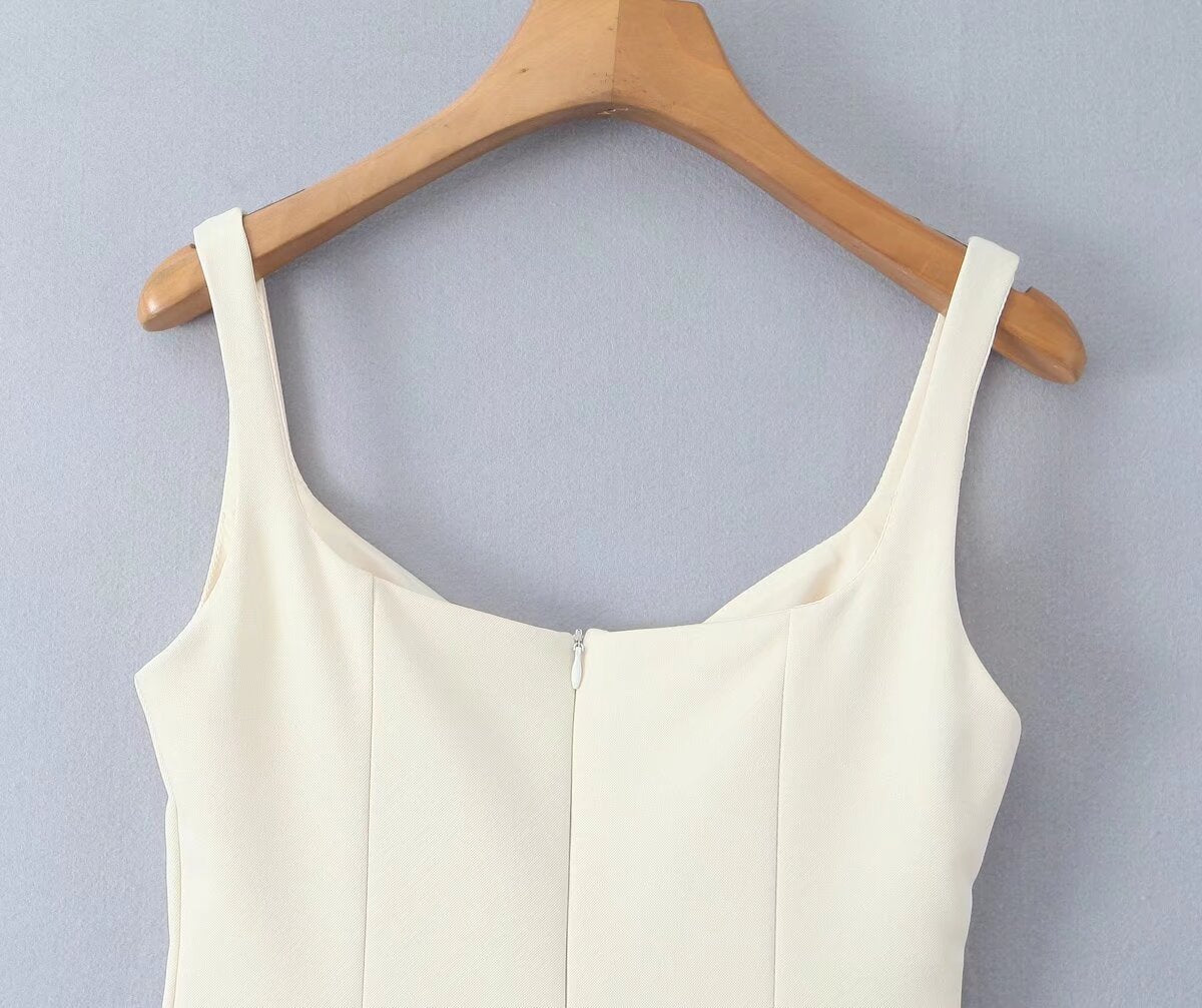 White sleeveless top on a wooden hanger, part of Stunning Retro Backless Dress fashion