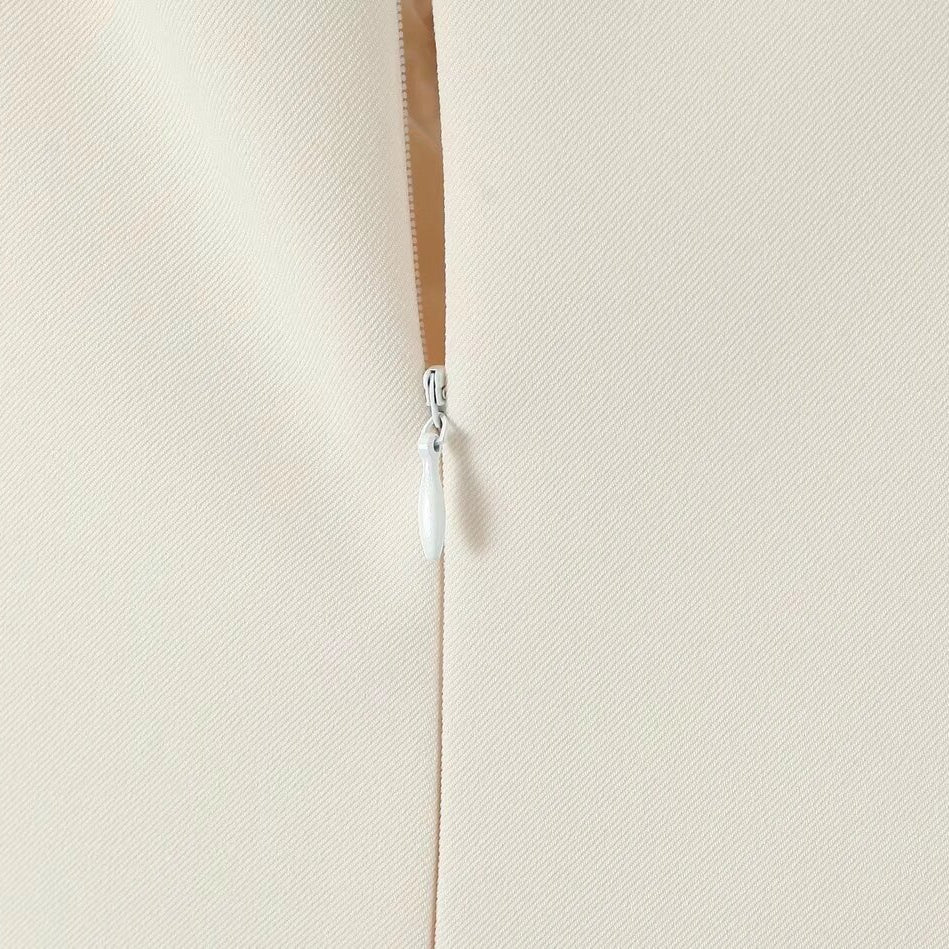 White zipper on a seam of the Stunning Retro Backless Dress, a stylish fashion choice