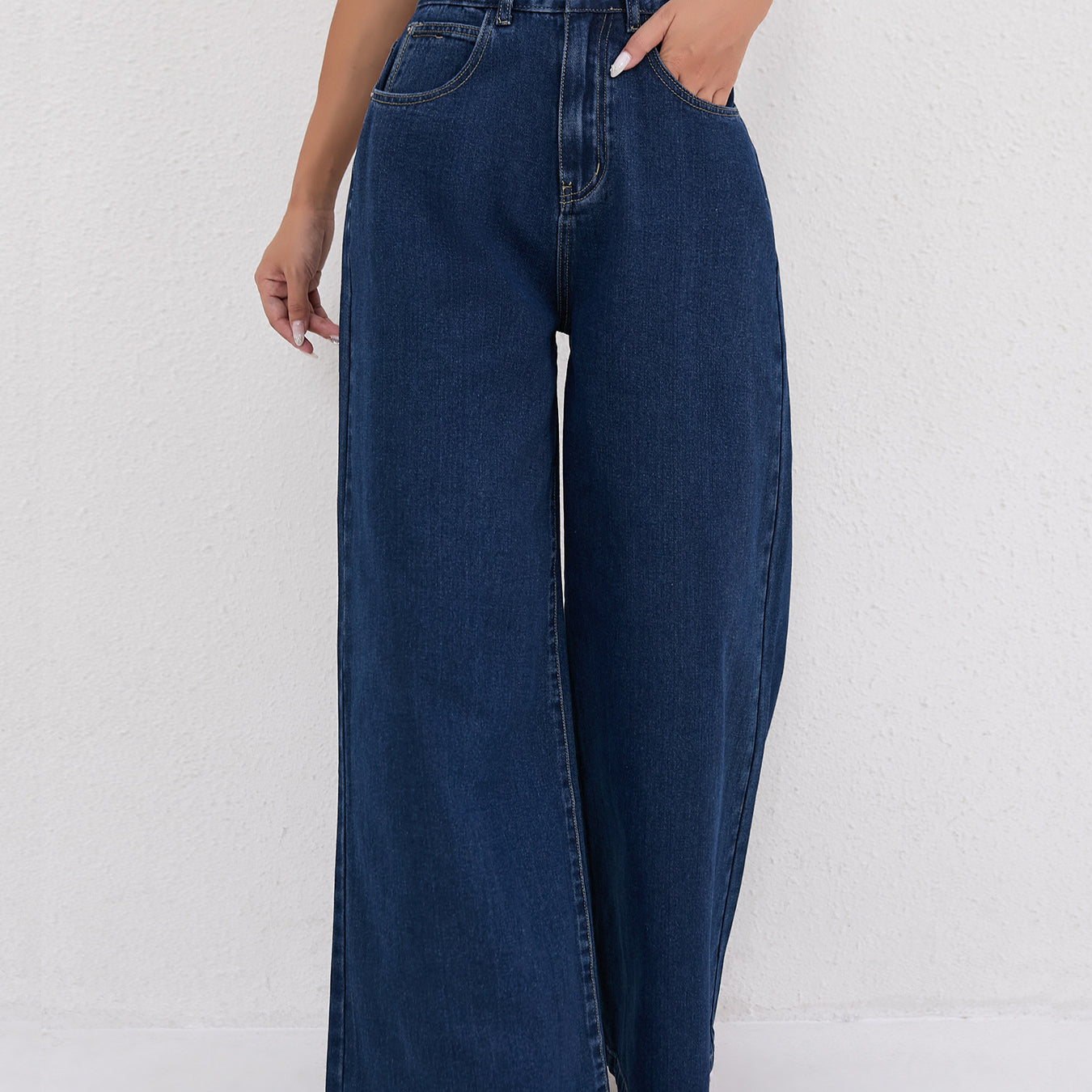 Dark blue wide leg mopping jeans featuring traditional five-pocket styling