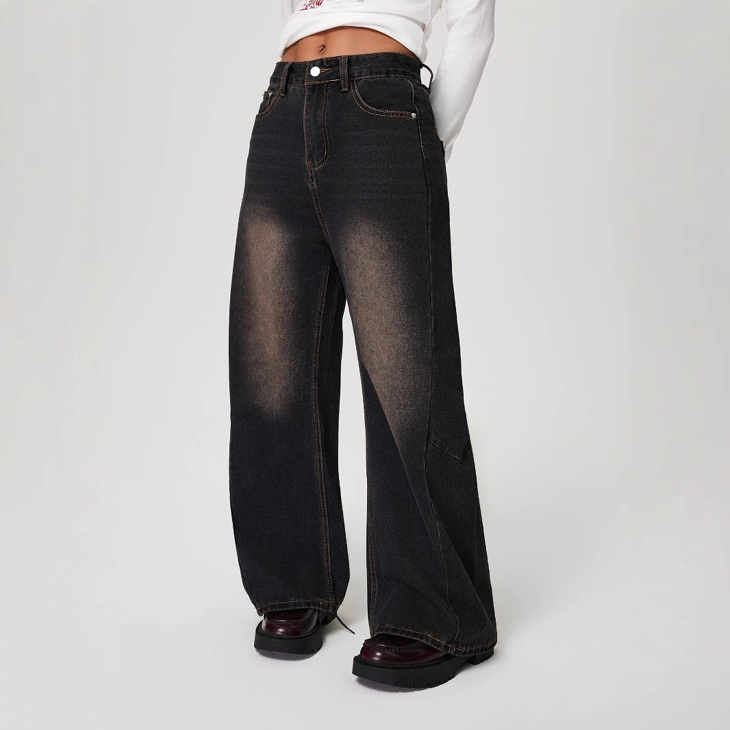 Wide-leg black denim jeans with faded knees, perfect for stylish ملابس and fashion trends