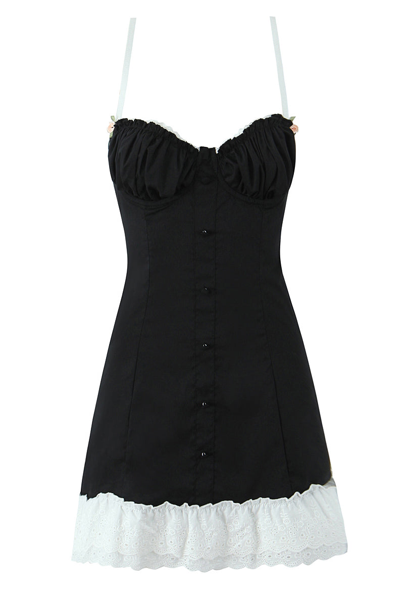 Black strapless dress with white ruffle trim, perfect for stylish fashion occasions