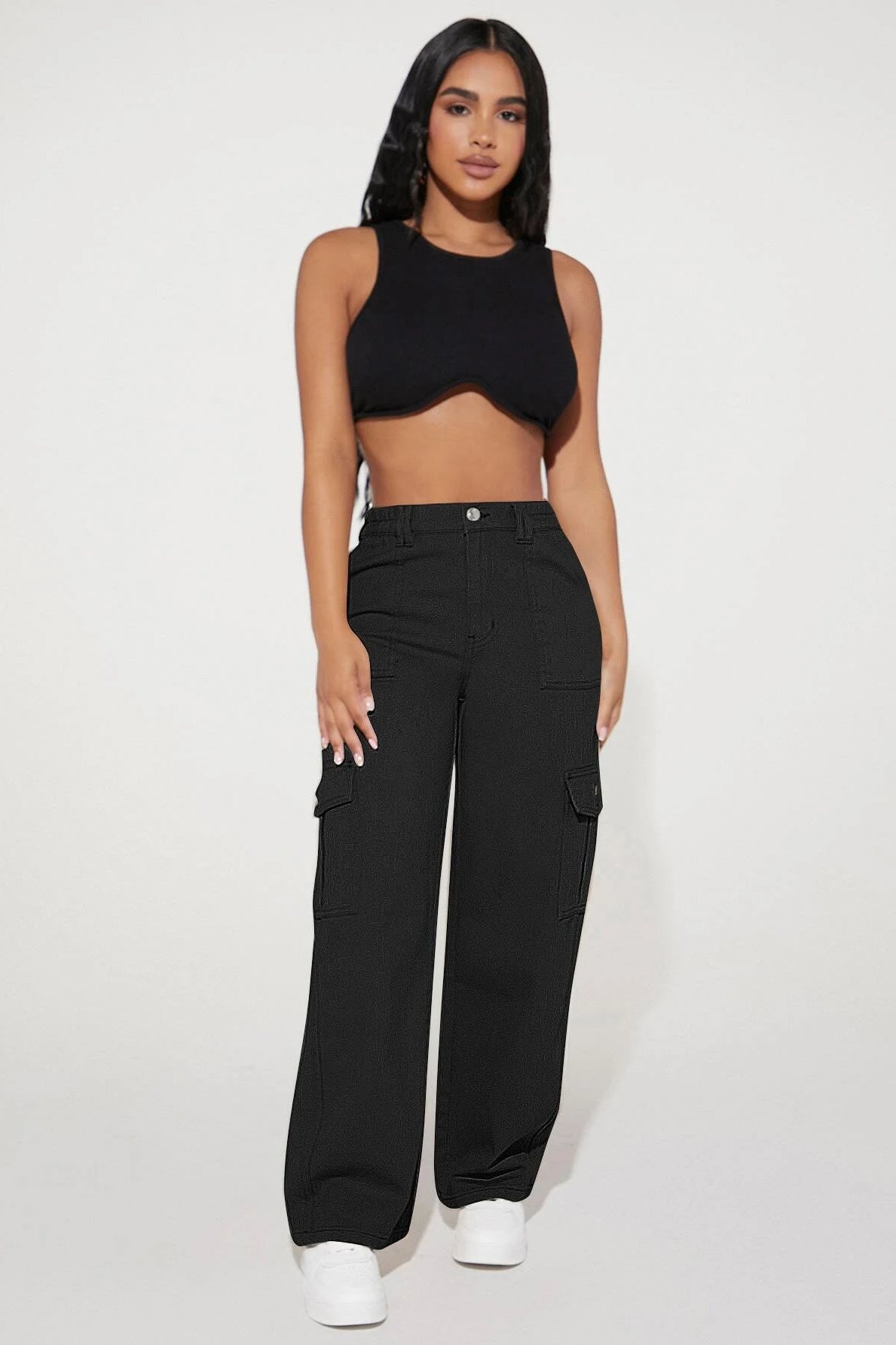 Woman in black crop top and cargo pants showcasing Cute Casual Pants fashion ملابس
