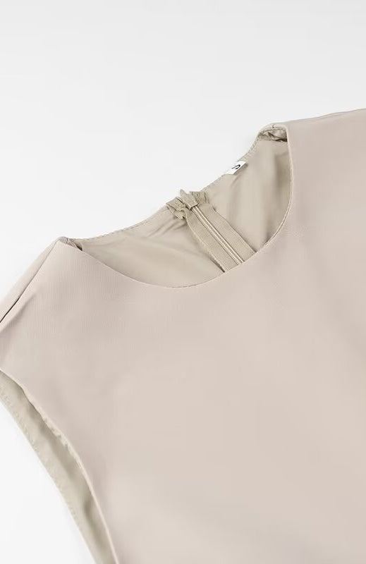 Elegant beige sleeveless langry fashion blouse with ruched neckline