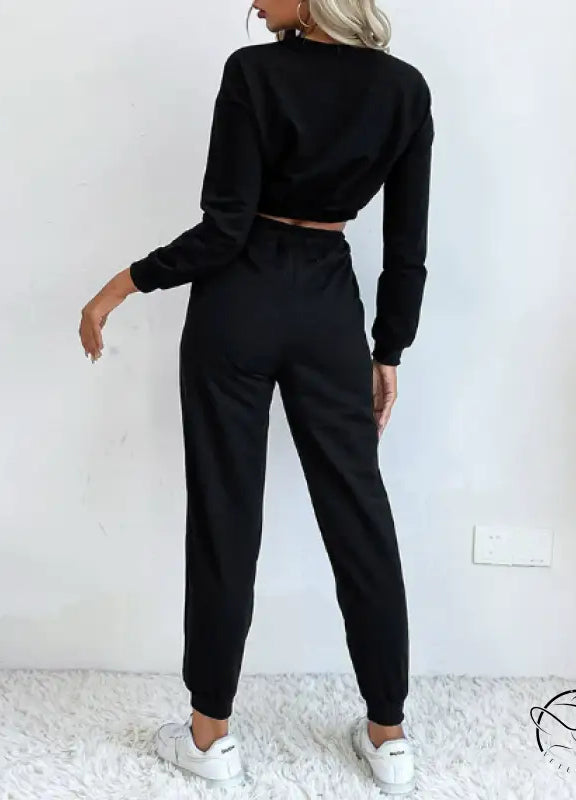 Casual black two-piece langry fashion set with cropped sweater and joggers