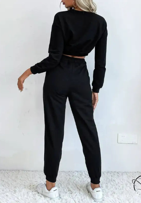 Casual black two-piece langry fashion set with cropped sweater and joggers