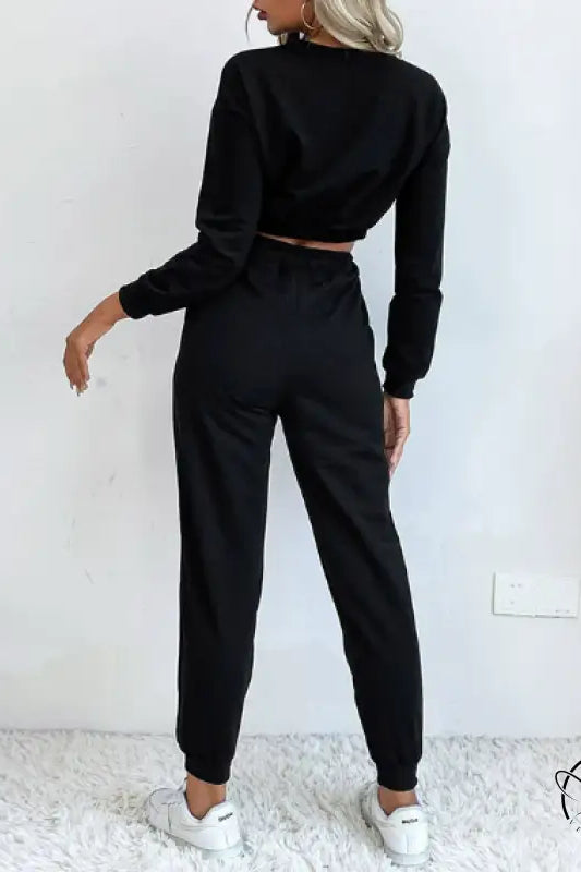 Casual black two-piece langry fashion set with cropped sweater and joggers