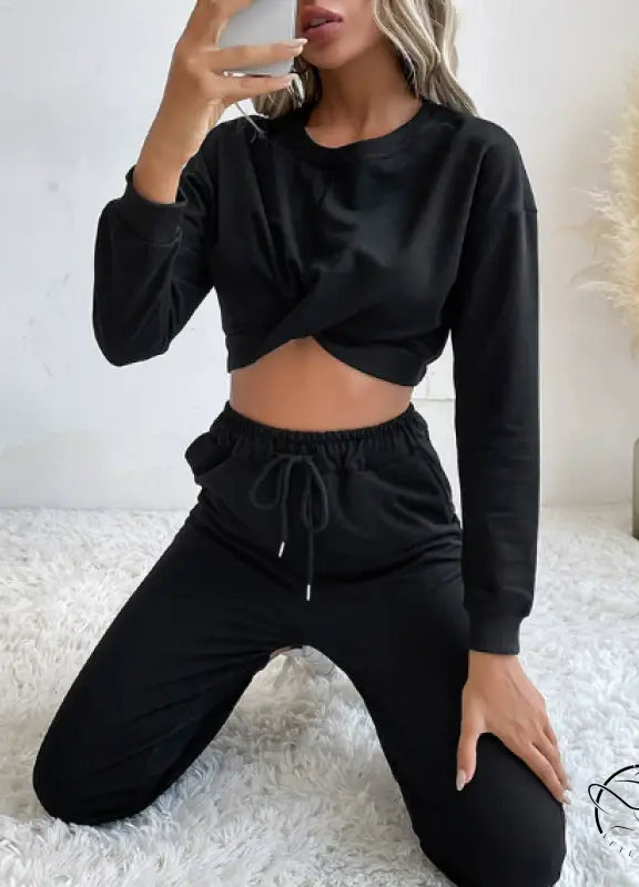 Casual black two-piece langry fashion set with twisted crop top and drawstring pants