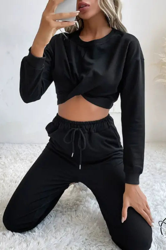 Casual black two-piece langry fashion set with twisted crop top and drawstring pants