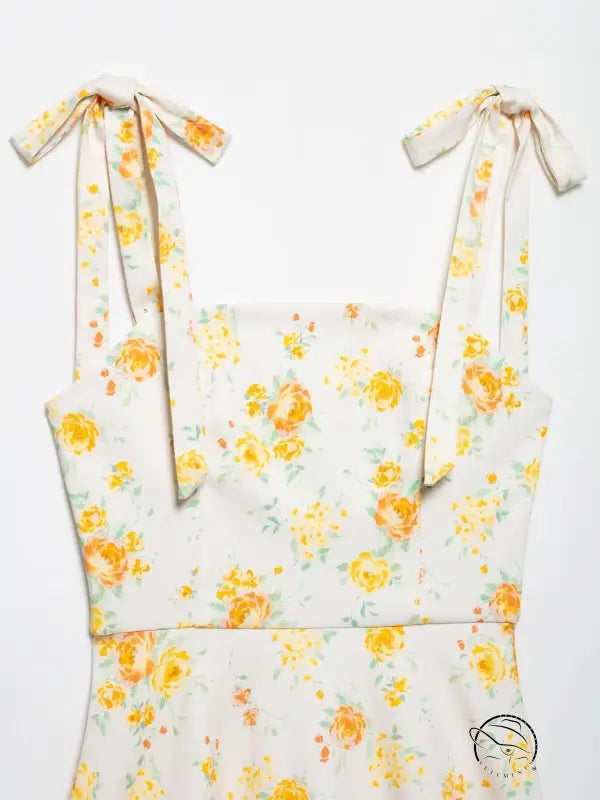 White floral print poplin dress with yellow roses, green leaves, tied straps