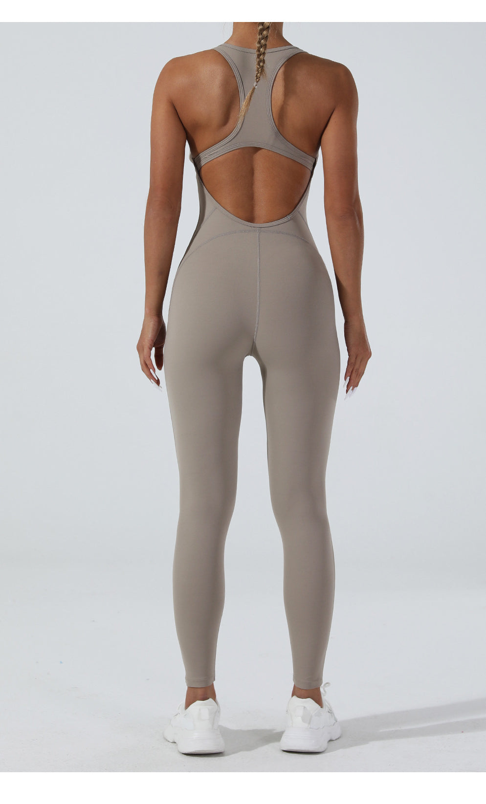 Sleek taupe langry yoga one-piece jumpsuit with racerback and open back