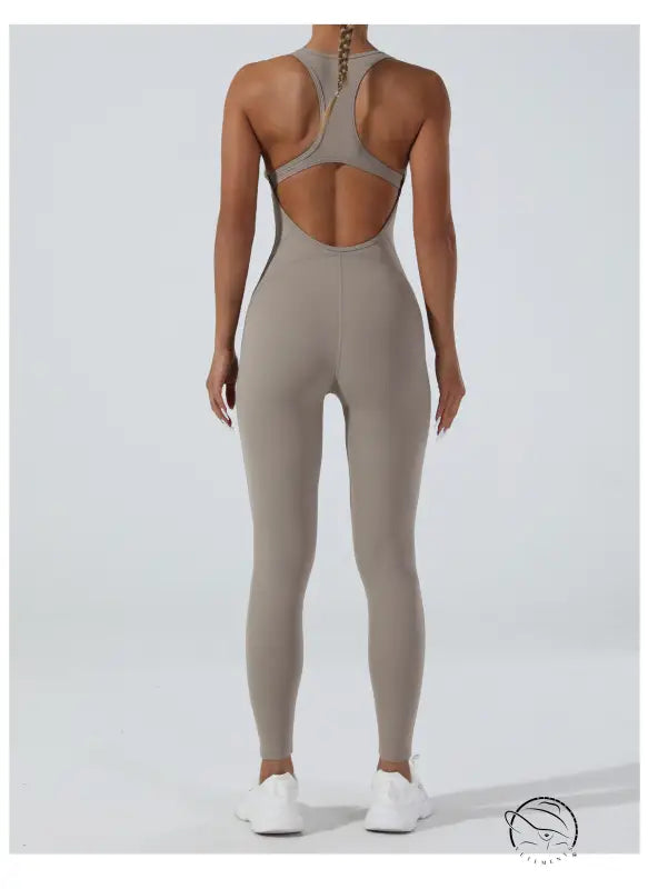 Sleek taupe langry yoga one-piece jumpsuit with racerback and open back