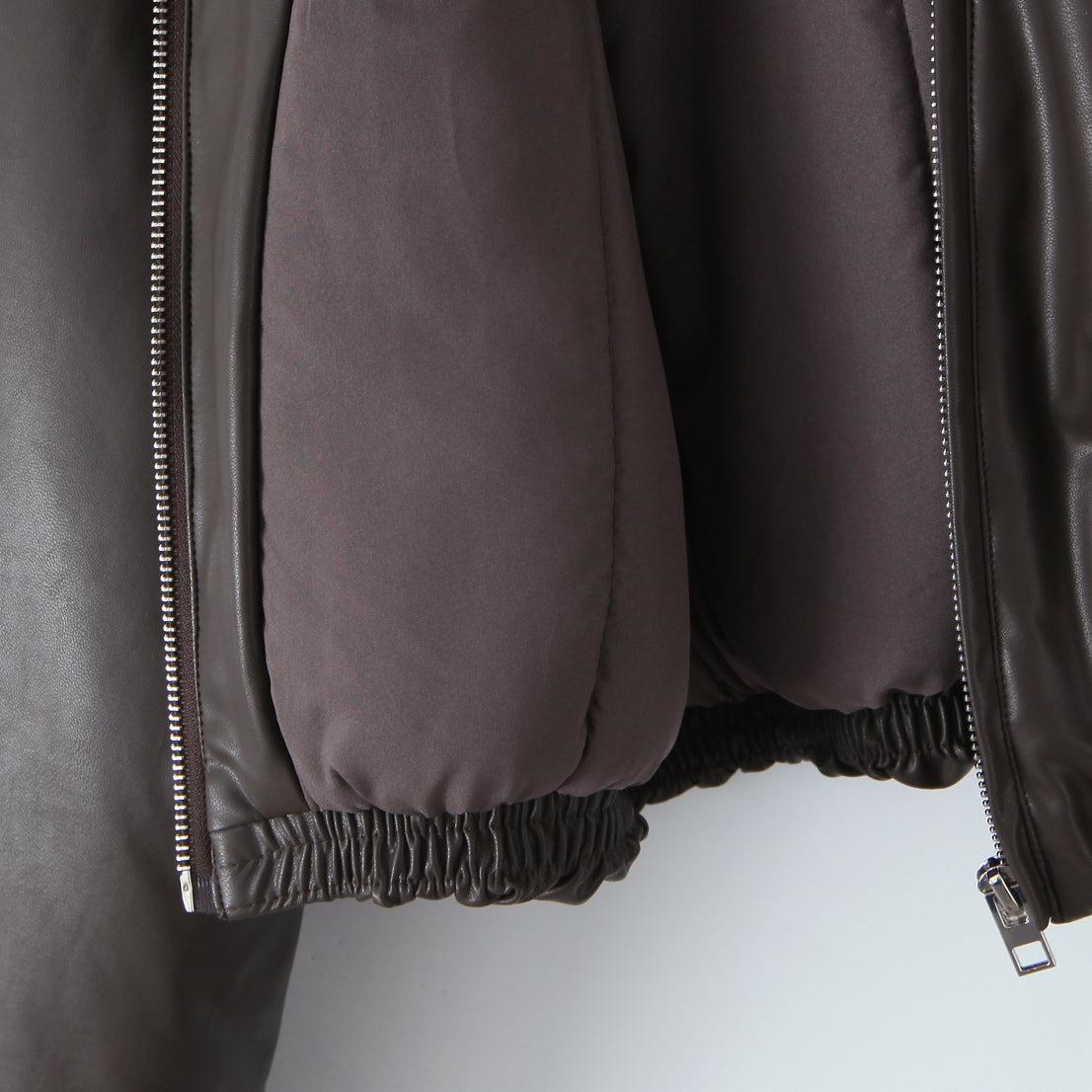 Loose faux leather bomber jacket by Langry with silver zipper and elastic hem