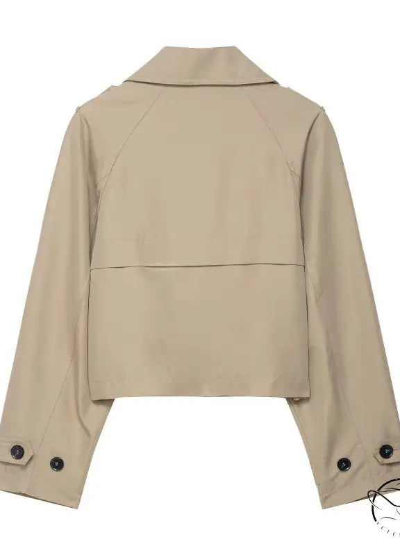 Beige double breasted short trench coat with buttoned cuffs