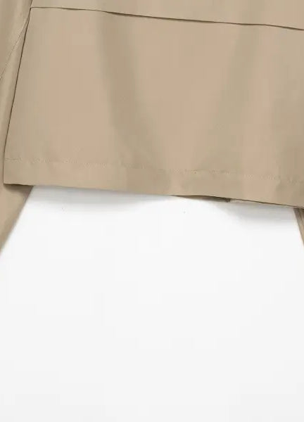 Casual double breasted short trench coat in beige with buttoned cuffs