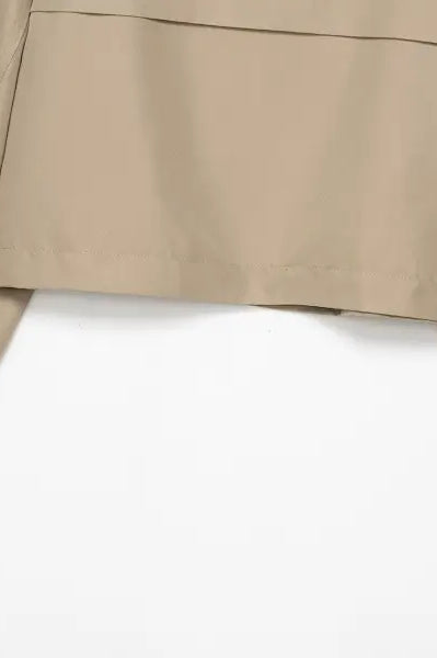 Casual double breasted short trench coat in beige with buttoned cuffs