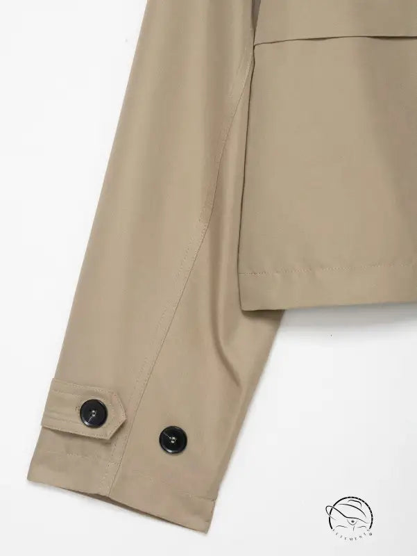 Casual double breasted short trench coat in beige with black buttons and pockets