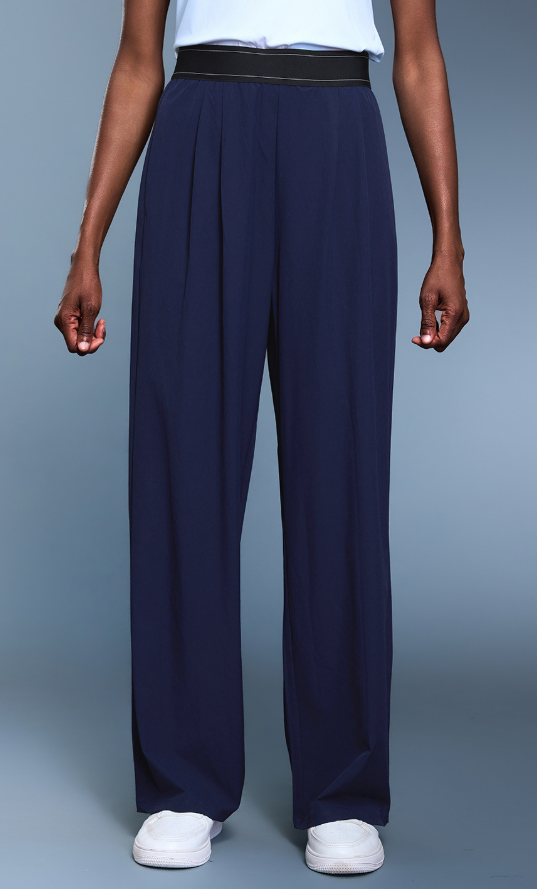 Navy blue langry fashion wide-leg pleated trousers with black waistband and white sneakers