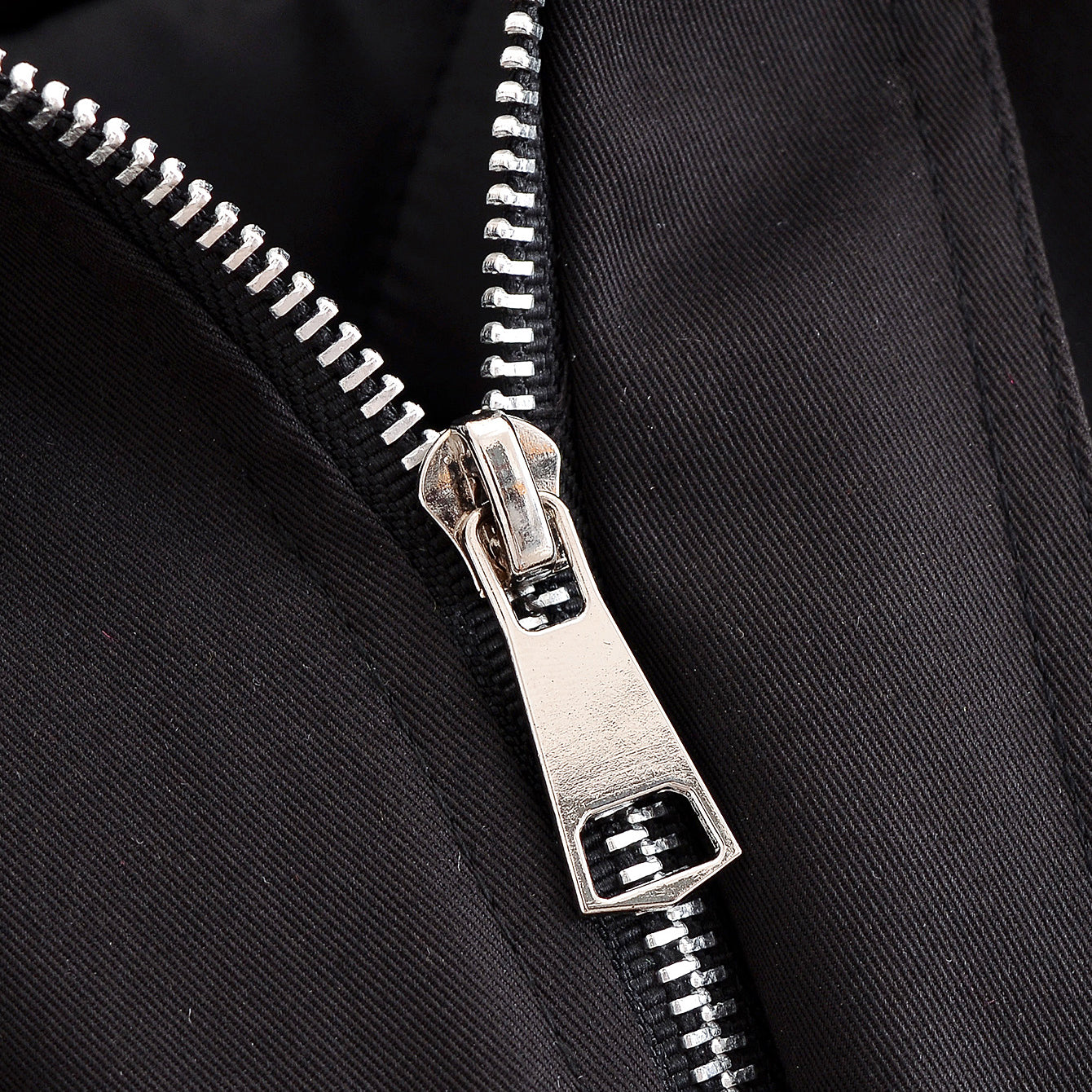Silver zipper with black fabric and metallic teeth on Langry fashion jacket