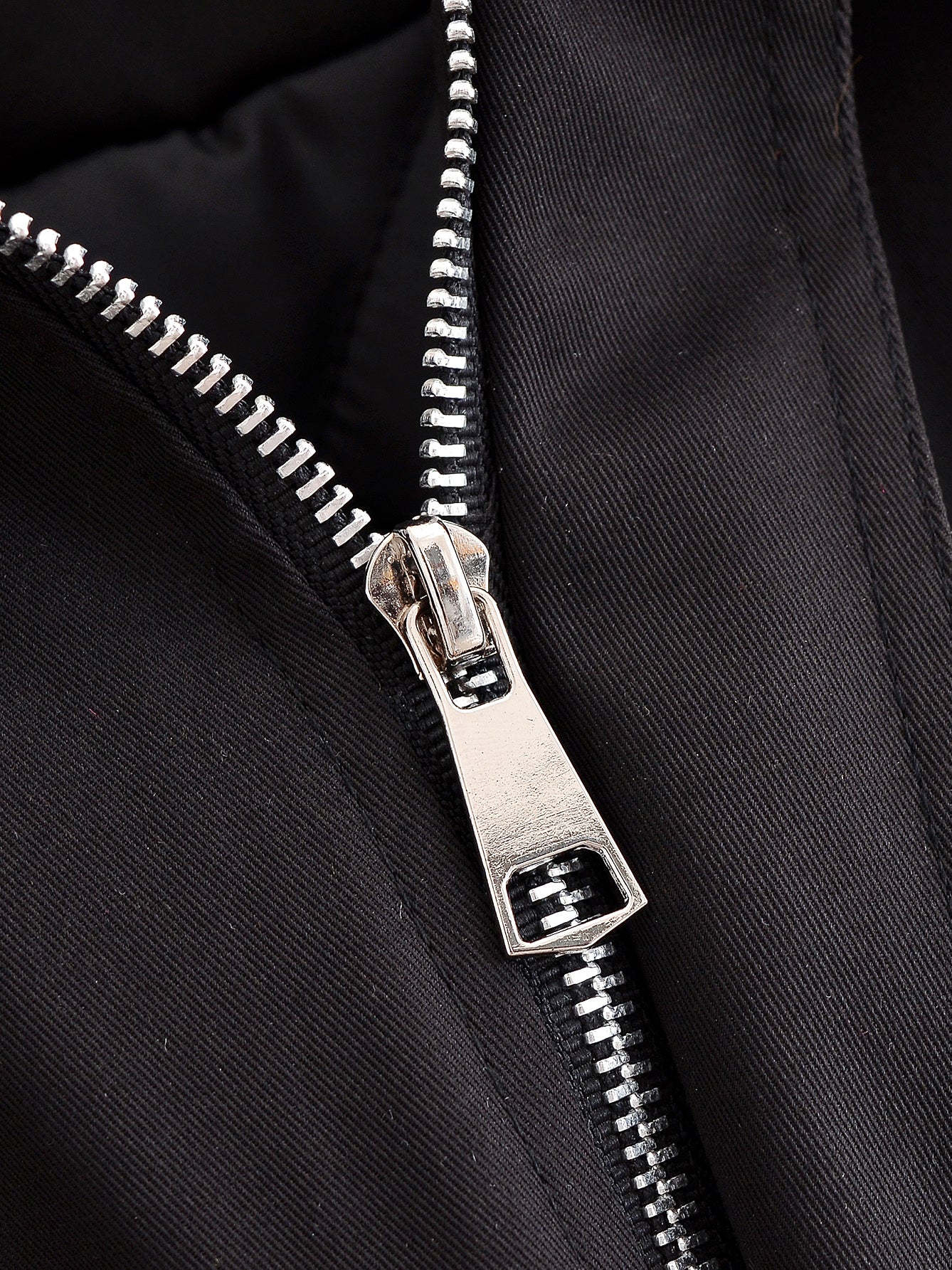 Silver zipper with black fabric and metallic teeth on Langry fashion jacket